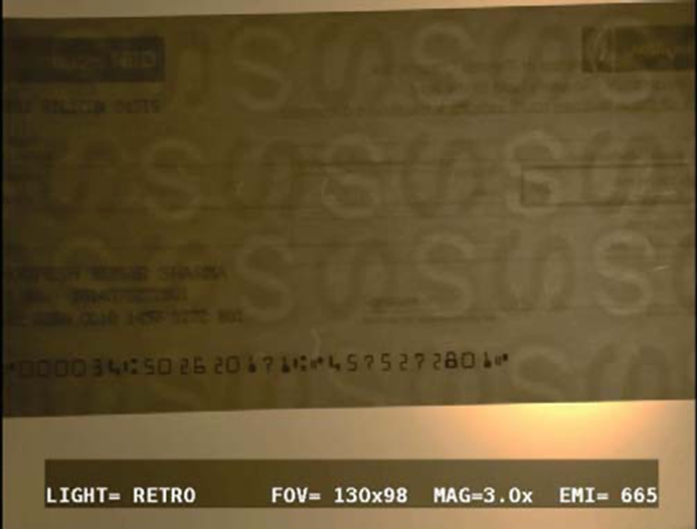 A picture showing the presence of water marks on a bank cheque.
